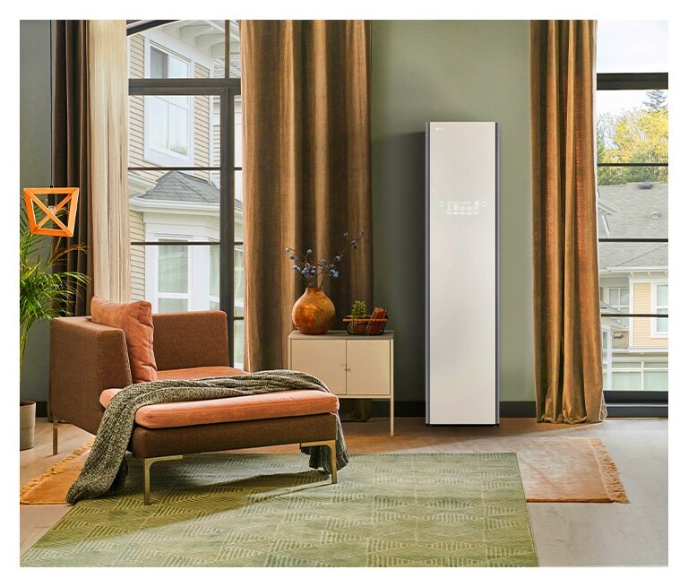 It shows nature green color LG Objet Collection Styler placed in the dressing room that matches naturally to the furniture around.
