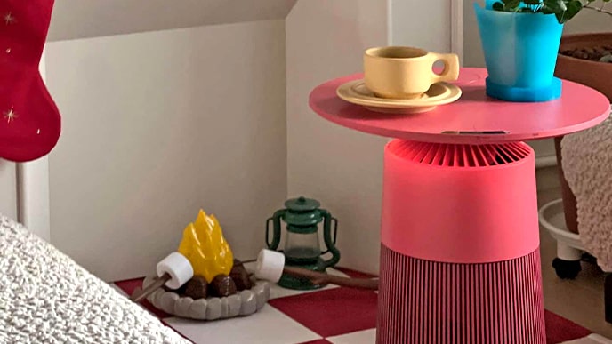 Products are placed in a room with colorful interiors. Coffee cups and pots are placed on top, serving as an interior accessory.