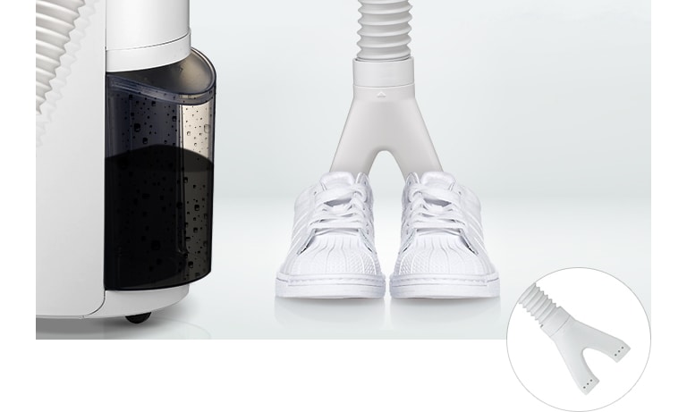 White sneakers being dried using a dual-hose attachment connected to the side of an LG appliance.