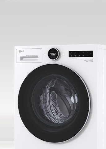 LG white front load washer dryer is shown from a slight side angle.