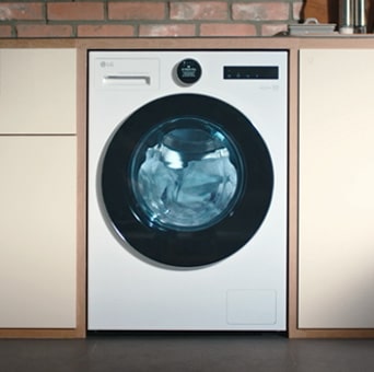 LG white front load washer dryer(F4X9EUP25M) shows a transparent drum with five arrows illustrating the large drum capacity.