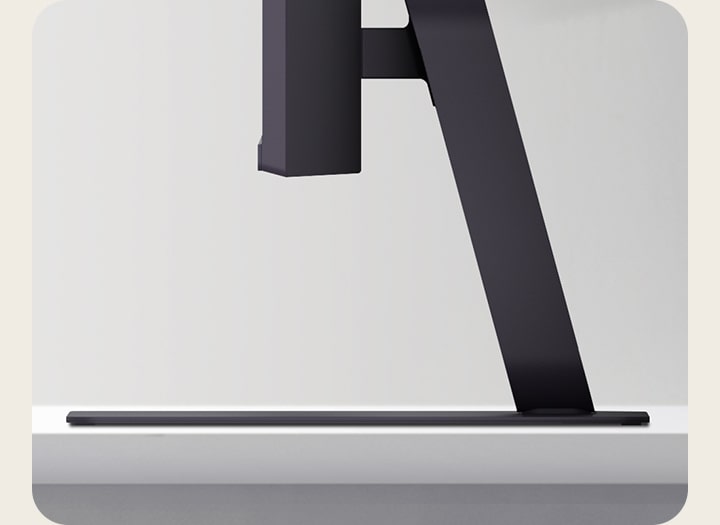 Side view of LG UltraGear monitor stand on a desk.	