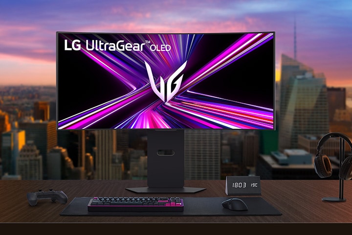 LG UltraGear OLED monitor setup on a gaming desk in a modern room.	