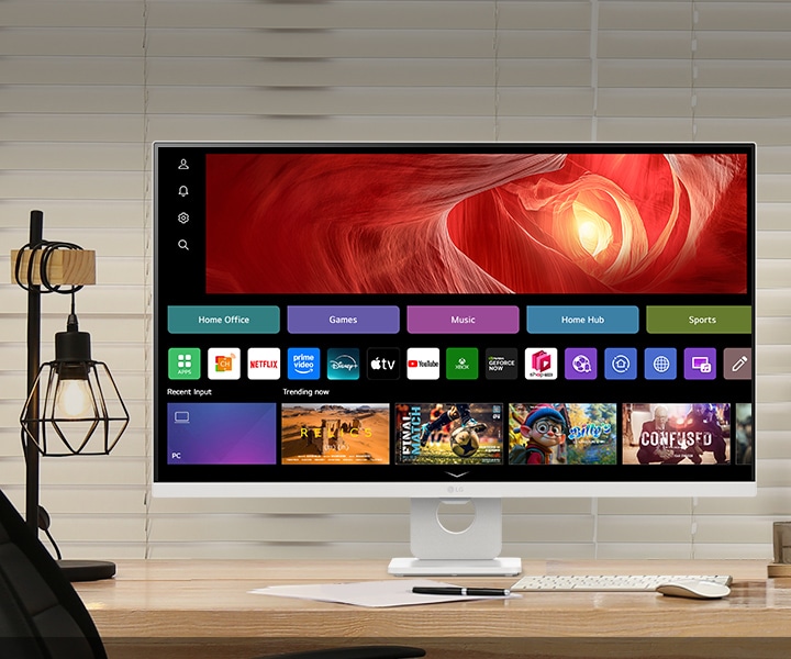 The picture shows a LG Smart Monitor on the desk, featuring work and play.
