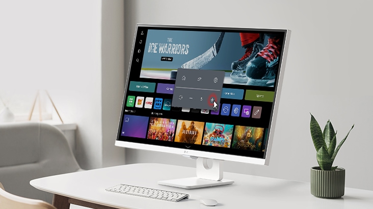 The LG Smart Monitor screen shows the webOS interface, and the volume is being turned up.