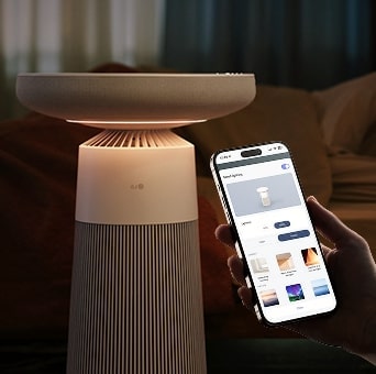Image of LG Aerospeaker with soft mood lighting, controlled via smartphone app in a cozy interior.