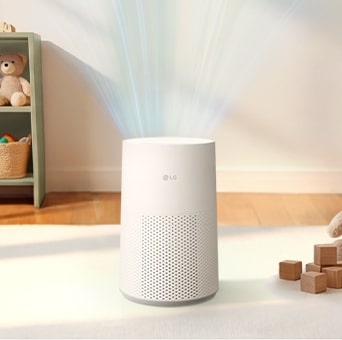 A white LG AeroMini air purifier in a room, with blue curved lines above it representing clean air circulation.	