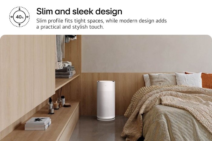 Compact white LG PuriCare™ AeroHit Pet air purifier placed in a cozy bedroom corner beside a wooden shelf. Text reads 'Slim and sleek design: Slim profile fits tight spaces, while modern design adds a practical and stylish touch.'