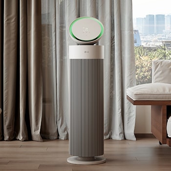 LG air purifier placed in a stylish living room with a beige sofa, dark bookshelf, and modern décor