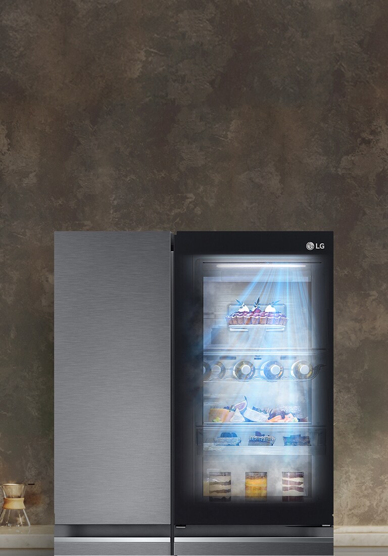 The front view of a black InstaView refrigerator with the light on inside. The contents of the refrigerator can be seen through the InstaView door. Blue rays of light shine down over the contents from the DoorCooling function.