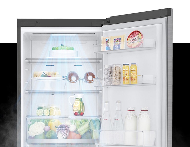 LG refrigerator open, showcasing neatly organized fresh produce, drinks, dairy, and bakery items on illuminated shelves.