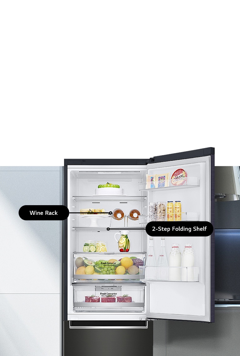 Open LG refrigerator with wine rack, 2-step folding shelf, storing cake, fruits, beverages, dairy, and organized food items.
