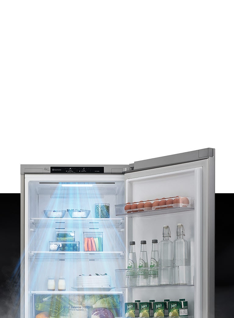 LG refrigerator with Multi Air Flow, eggs on door shelf, bottles and jars on shelves, vegetables in crisper drawer.
