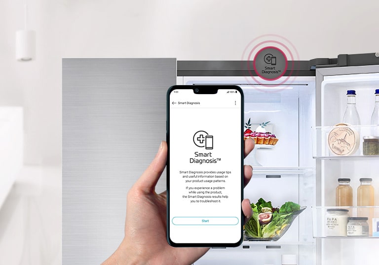 A hand holds a smartphone with the Smart Diagnosis app, aimed at the Smart Diagnosis symbol inside an open LG refrigerator.