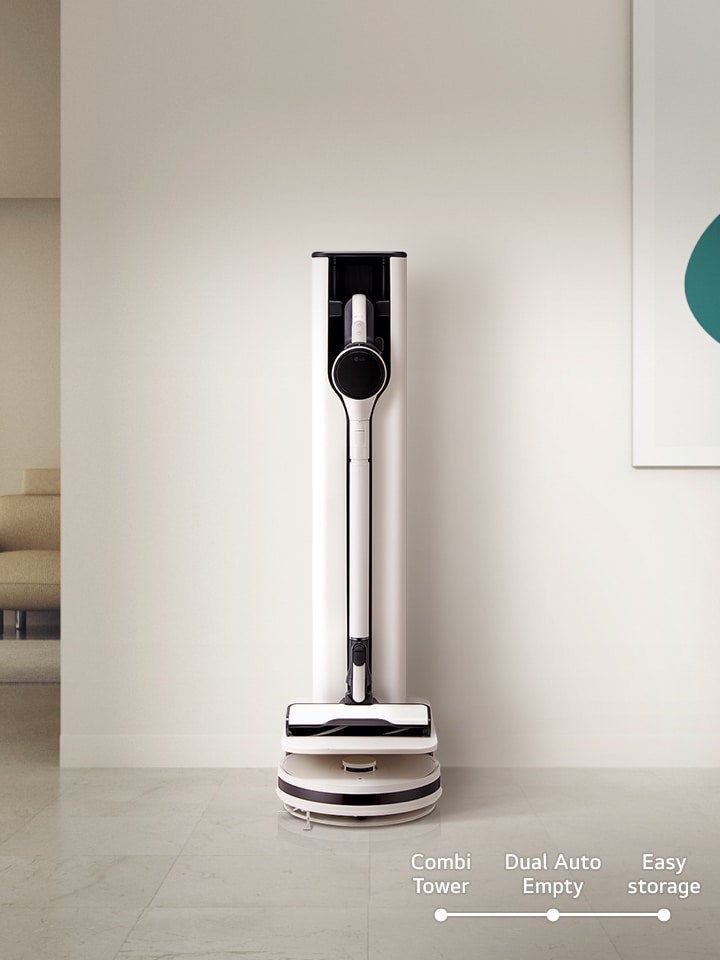 Stick vacuum leaning against the wall.