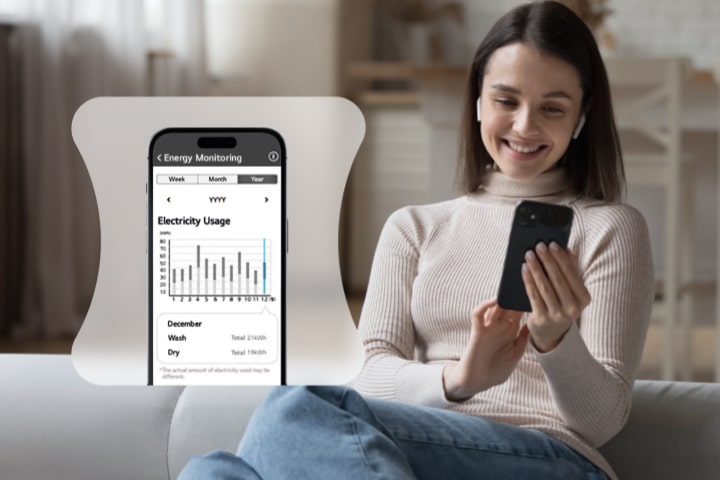 A woman monitoring her energy usage through a thinq app	
