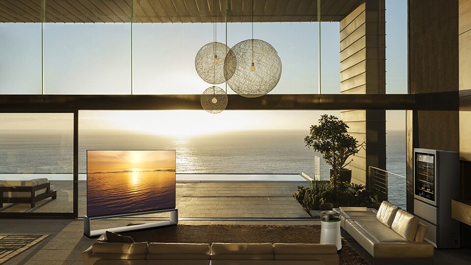 LG SIGNAUTURE OLED 8K TV and Wine Cellar are displayed in the costal view living room.