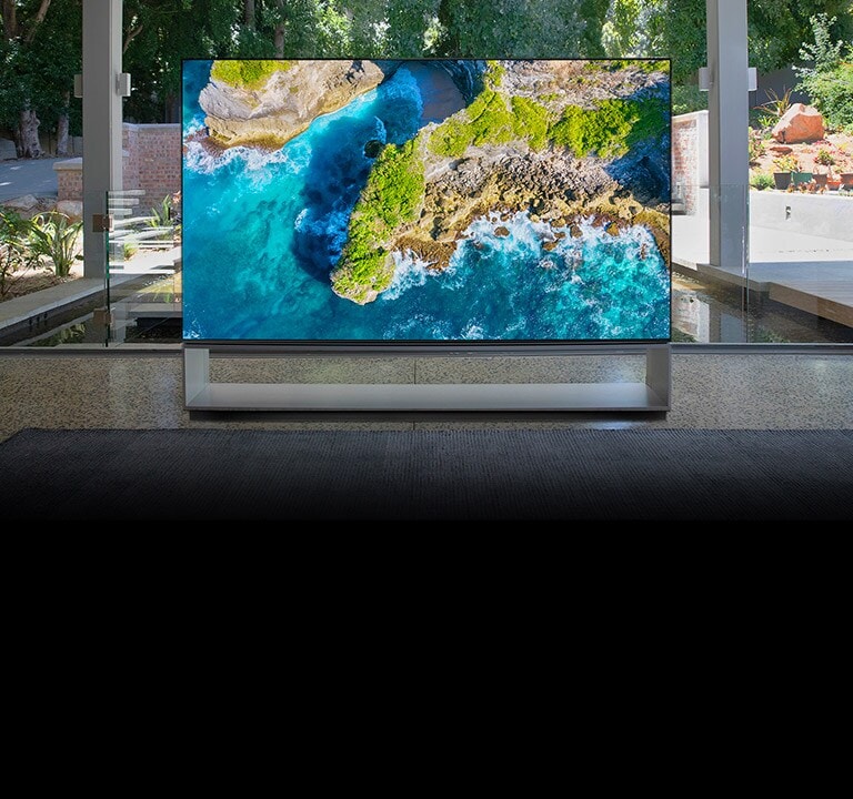 Rollable TV, situated in front of the pond of a luxurious house, showing step-stone bridge (scroll down the page)
