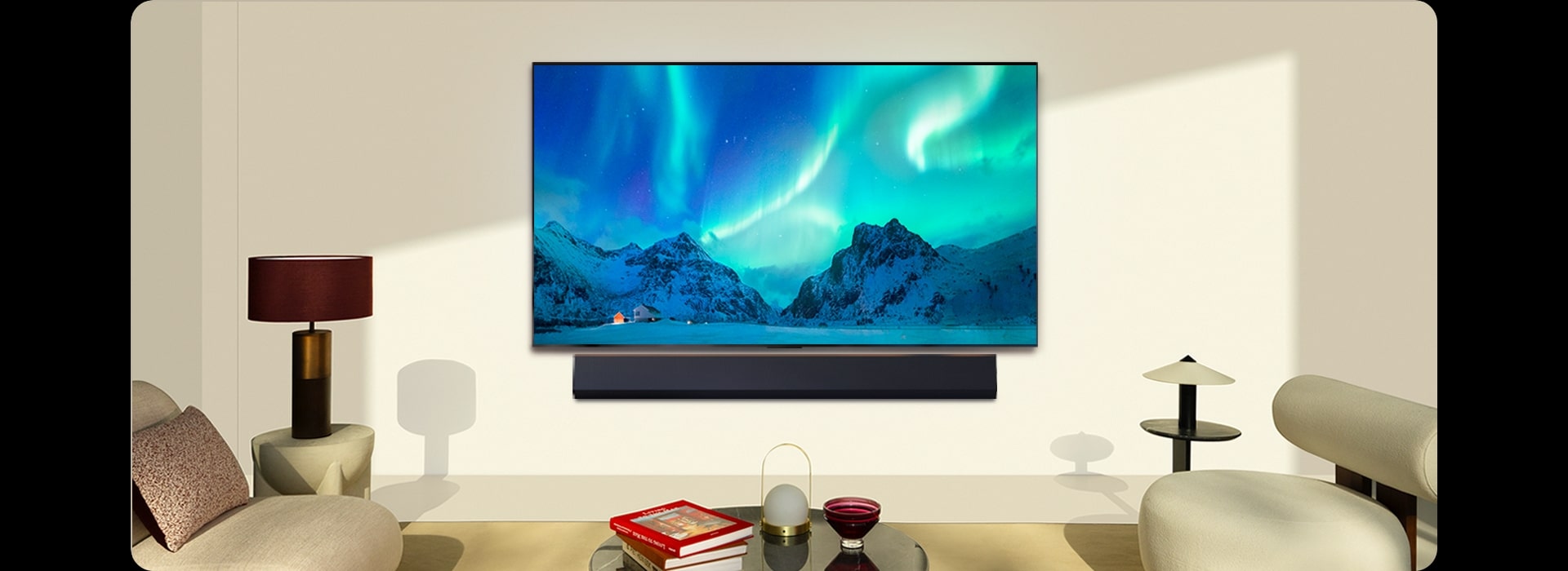 LG OLED TV and LG Soundbar in a modern living space in daytime. The screen image of the aurora borealis is displayed with the ideal brightness levels.