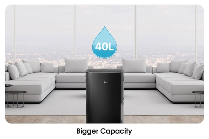 Bigger Capacity_The dehumidifier is located in a wide living room, enabling large-capacity dehumidification.