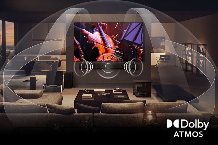 Dimly lit, cozy living room with an OLED LG TV with LG Soundbar. On the screen is a close-up of an electric guitar being played. Graphics show how Dolby Atmos fills the whole space with surround sound from all directions. Dolby Atmos logo is at the bottom corner.