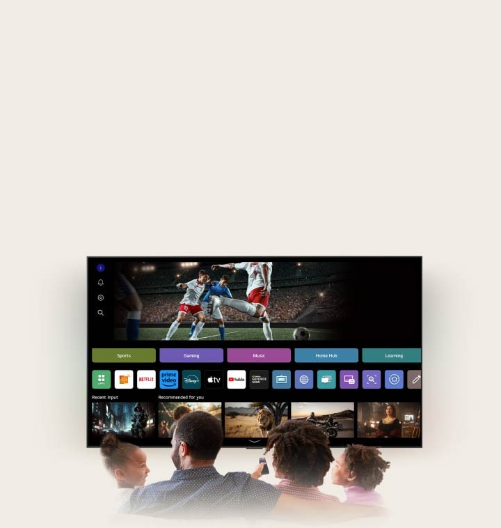 Family of four is gathered around an LG AI TV. A circle appears around the person holding the remote showing their name. This showcases how AI Voice ID recognizes each user's voice signature. The webOS interface then shows how the AI automatically switches the account and recommends personalized content. 