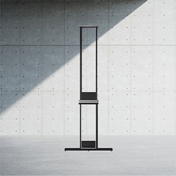 Side view of LG SIGNATURE OLED T with the Zero Connect Box placed on the floor directly below. 