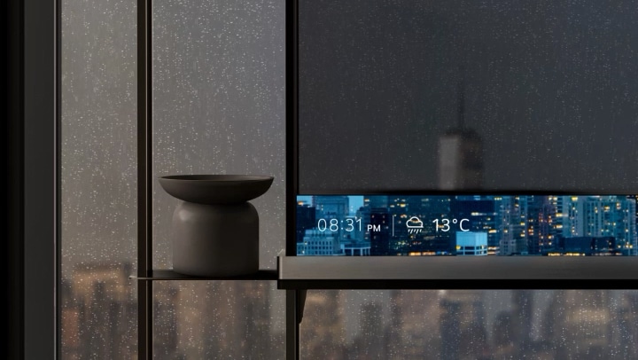 LG Signature OLED T sits in a modern space with the T-Bar displaying information. Transitions to a zoomed in shot of the LG Signature OLED T and T-Bar displaying information on a background.	
