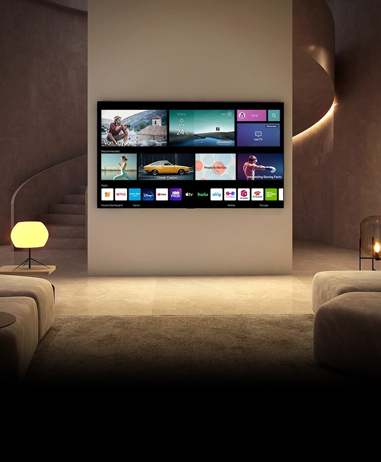 There is a TV hanging on a luxury living room – TV turns on and shows home screen as the space also gets brighter.