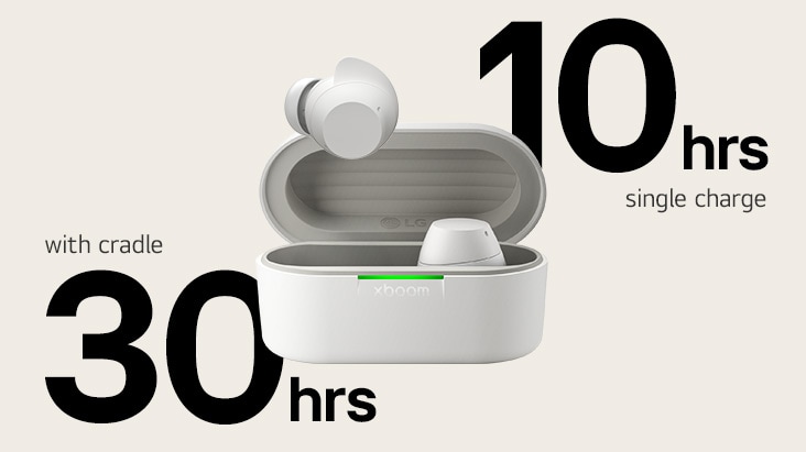 A white xboom Buds cradle is placed with its light on and with a pair of earbuds in it.