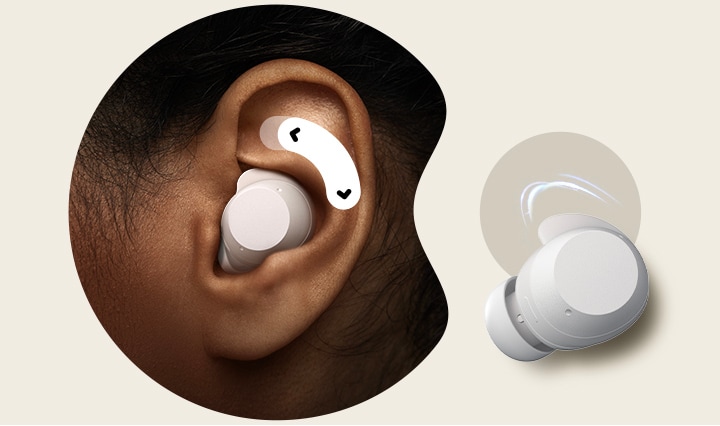 A person's left ear with a unit of white xboom Buds in it. Above the earbud, there's a two-way arrow.