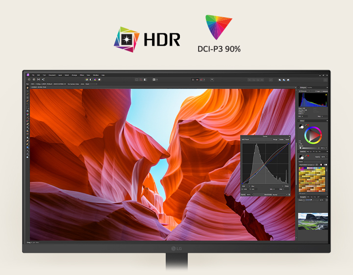 Egy fehér LG monitor elülső nézete, amely élénk kanyon-képeket jelenít meg színkorrekciós eszközökkel, kiemelve a HDR-t és a 90%-os DCI-P3 színlefedettséget.