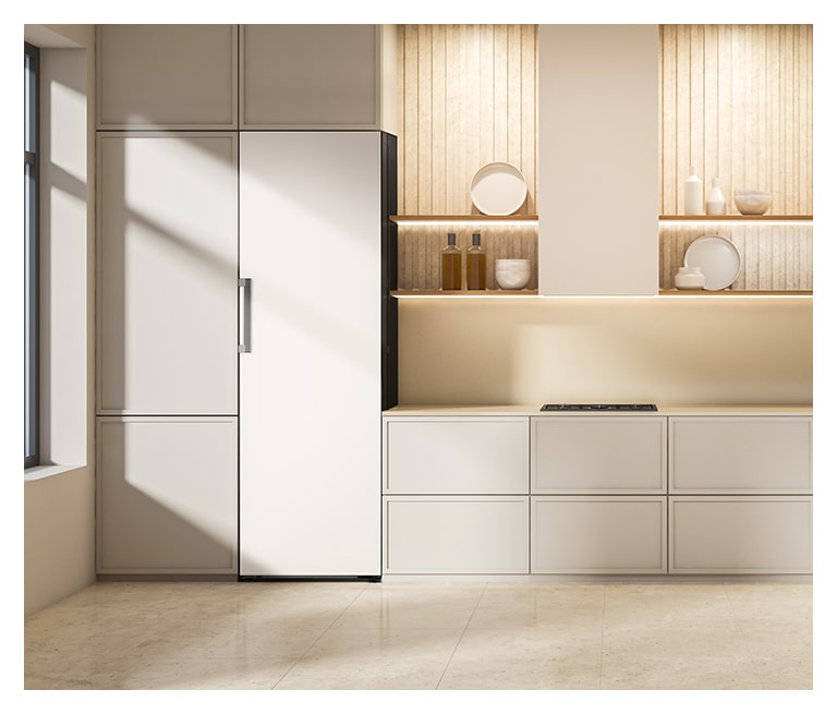 It shows mist beige color LG Larder Objet Collection is placed in the kitchen that matches naturally to the furniture around.