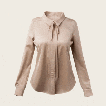 Blus beige, dilapisi teknologi sensor digital, menghadirkan deteksi kain AI Wash