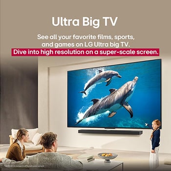A family sits on a couch facing a LG QNED TV mounted on a wall above a LG Soundbar with a little girl pointing to a screen depicting two dolphins. The title talks about how every action is more thrilling on a massive screen.