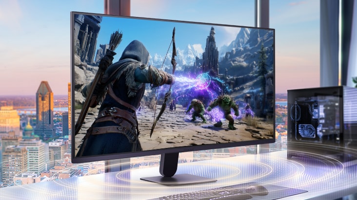 UltraGear™ gaming monitor on a desk setup with a desktop PC, displaying a fantasy action game scene and highlighting an immersive gaming environment with built-in stereo speakers for audio during gameplay.