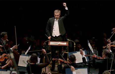 This is an image of the Royal Philharmonic Orchestra performing onstage.