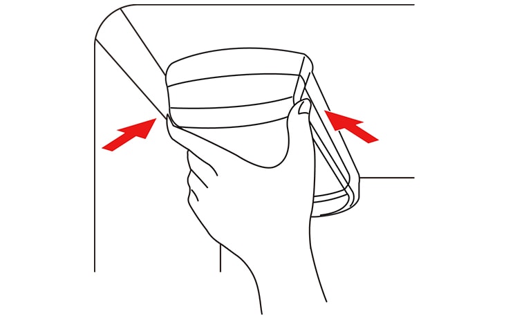 Pinch the sides to open the water filter cover