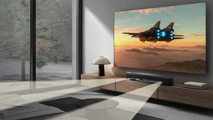 TV with scientific content is shown and SF1A soundbar is placed right below. On the floor the soundbar's sub woofer also stands. White semi-transparent sound waves are coming widely out of soundbar and the subwoofer. On the bottom right dts logo and Dolby Digital Audio logos are placed.