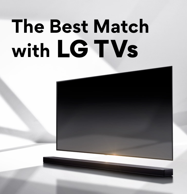 A soundbar and a TV are placed on a white floor and there is a shadow coming from outside right behind.