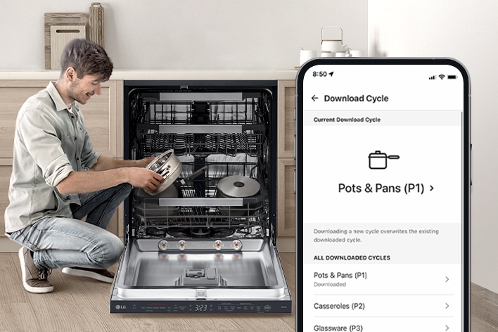A man is holding a pot next to a dishwasher while a smartphone displays a pots cycle on the ThinQ™ app. 