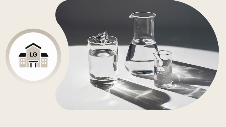 A minimalist still life of clear glassware—two drinking glasses and a carafe filled with water placed on a white surface, with soft natural light casting reflective shadows.	
