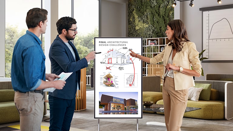 People are having a meeting while looking at the screen of the product