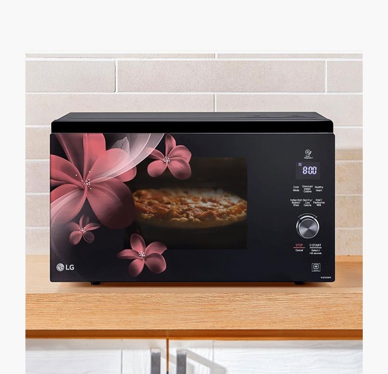 A front view of a microwave oven heating a pie
