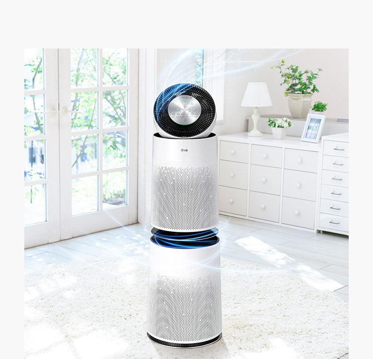 A full shot of an air purifier with clean air coming out in a living room