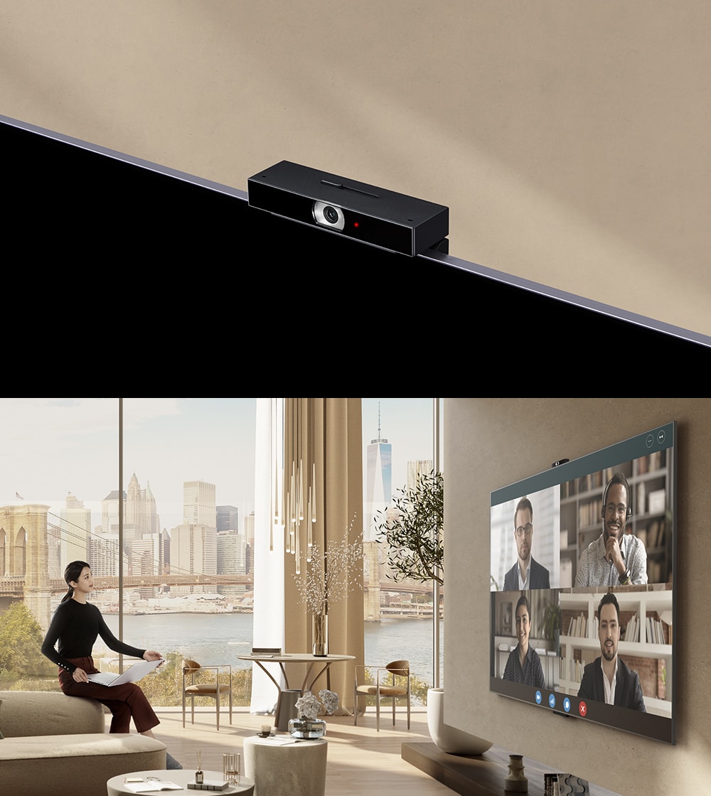 LG 86UR8050PSB A woman is sitting on an armrest of a sofa, holding a laptop and watching TV. Inside the TV on the big screen, you can see four characters and a video conference.