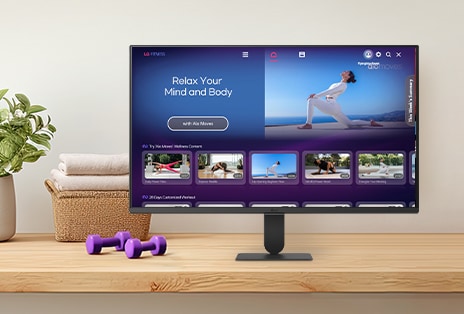 The LG Smart Monitor screen is showing various LG Fitness videos.
