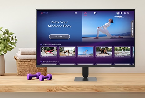 The LG Smart Monitor screen is showing various LG Fitness videos.
