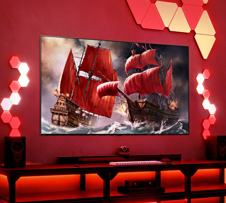 QNED TV is placed on red gaming room that have many lighting tiles. In TV screen, it shows two red pirate ships on raving ocean.