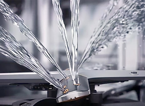 Immagine dei getti d'acqua che escono dai bracci QuadWash.